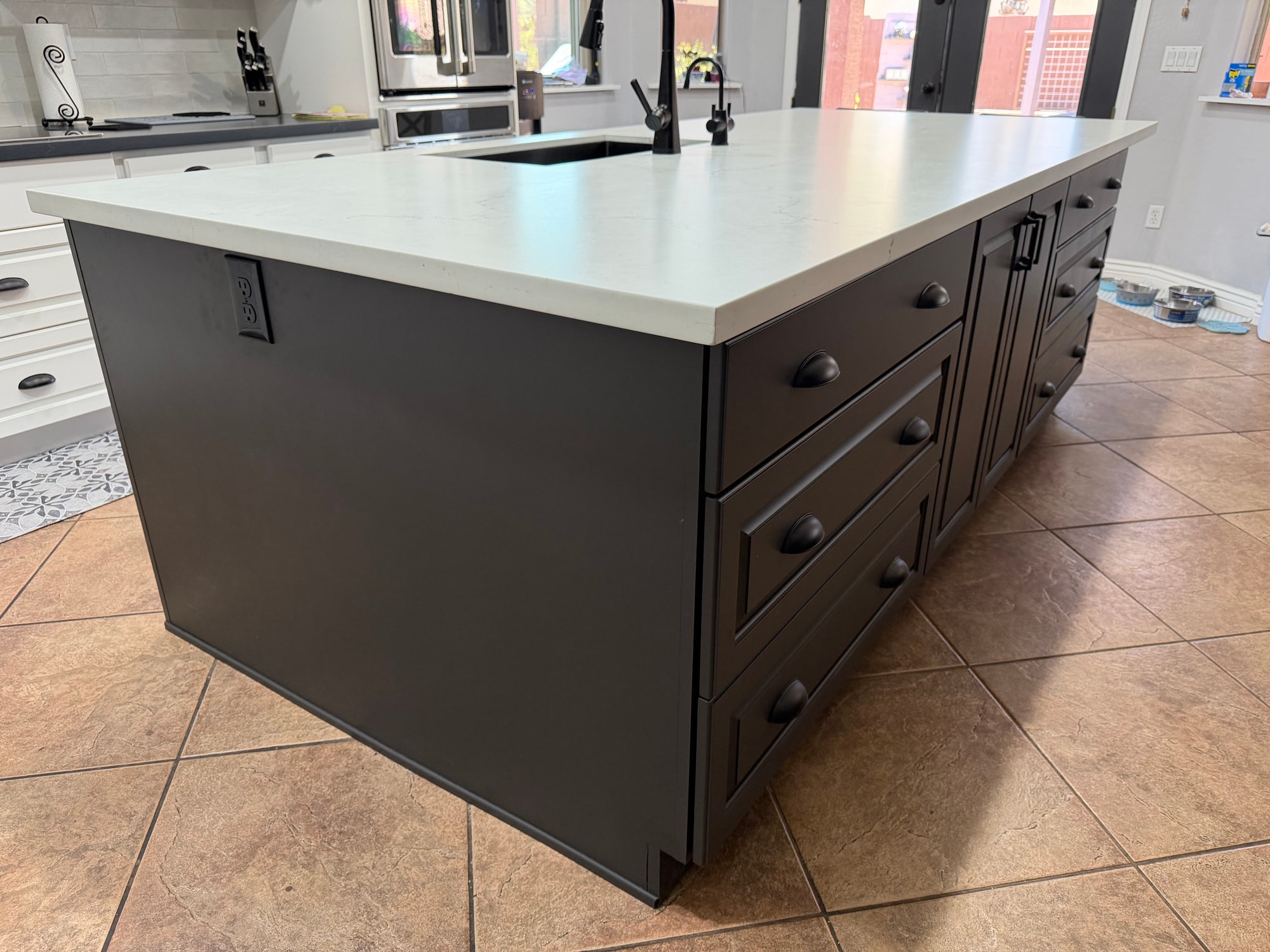 Chandler kitchen — opposite side of the new island showing the double-sided drawer banks (usable storage on both long sides) in Sollid Midnight Sun Matte grey with black cup pulls