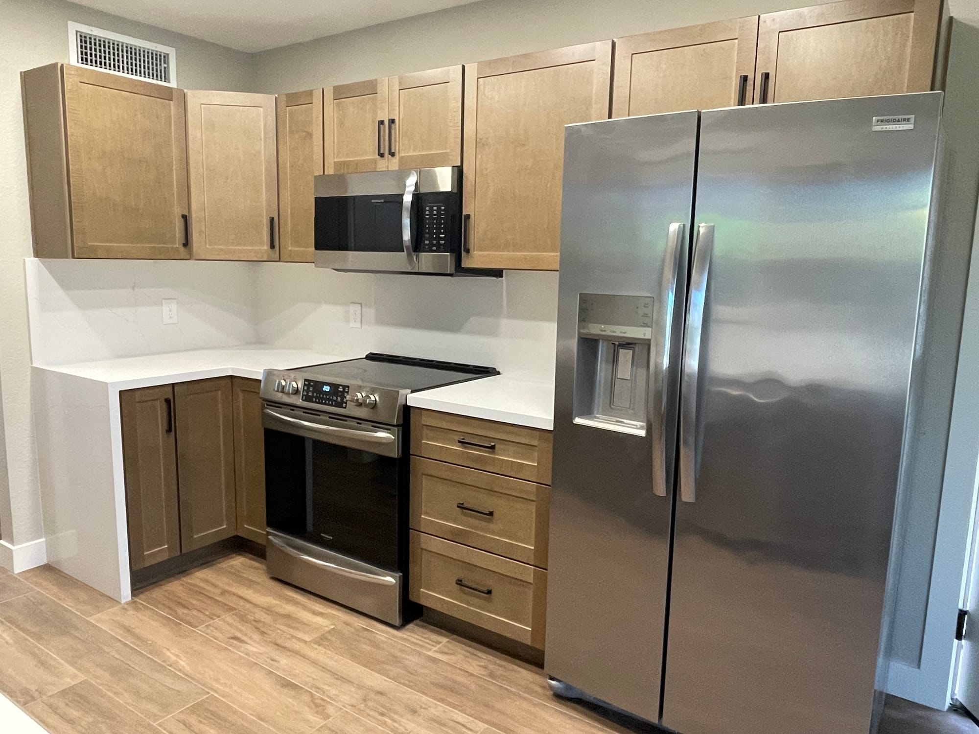 Custom kitchen remodel — quartz waterfall island and matte black fixtures