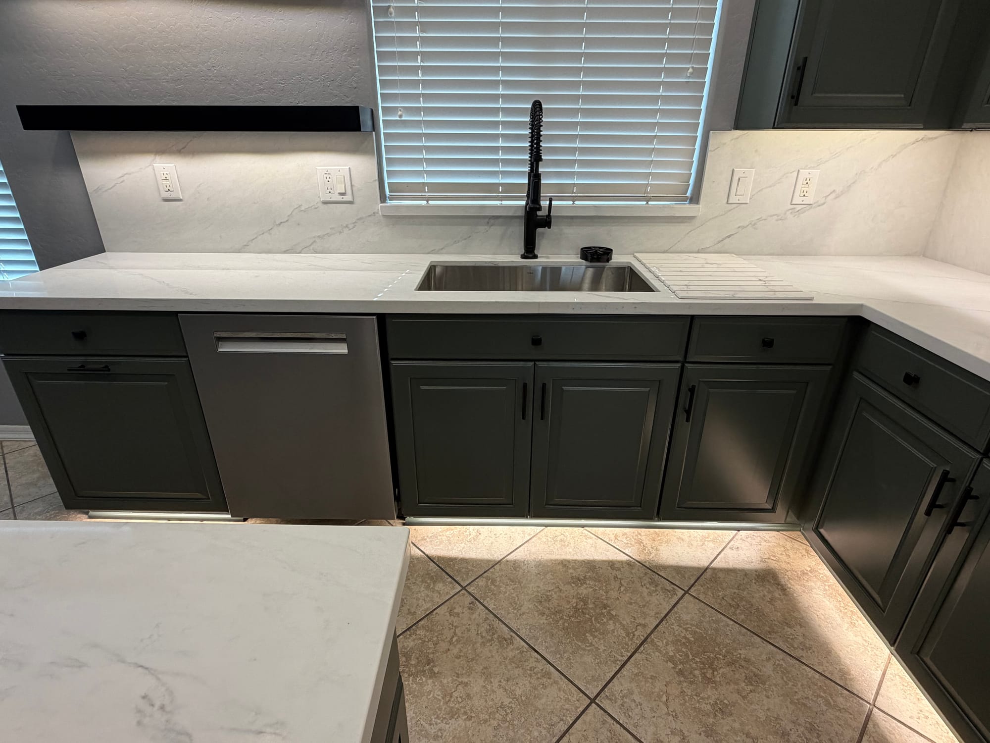 Gilbert kitchen — close-up of new black pull-down faucet, undermount sink, and white Della Terra quartz countertop
