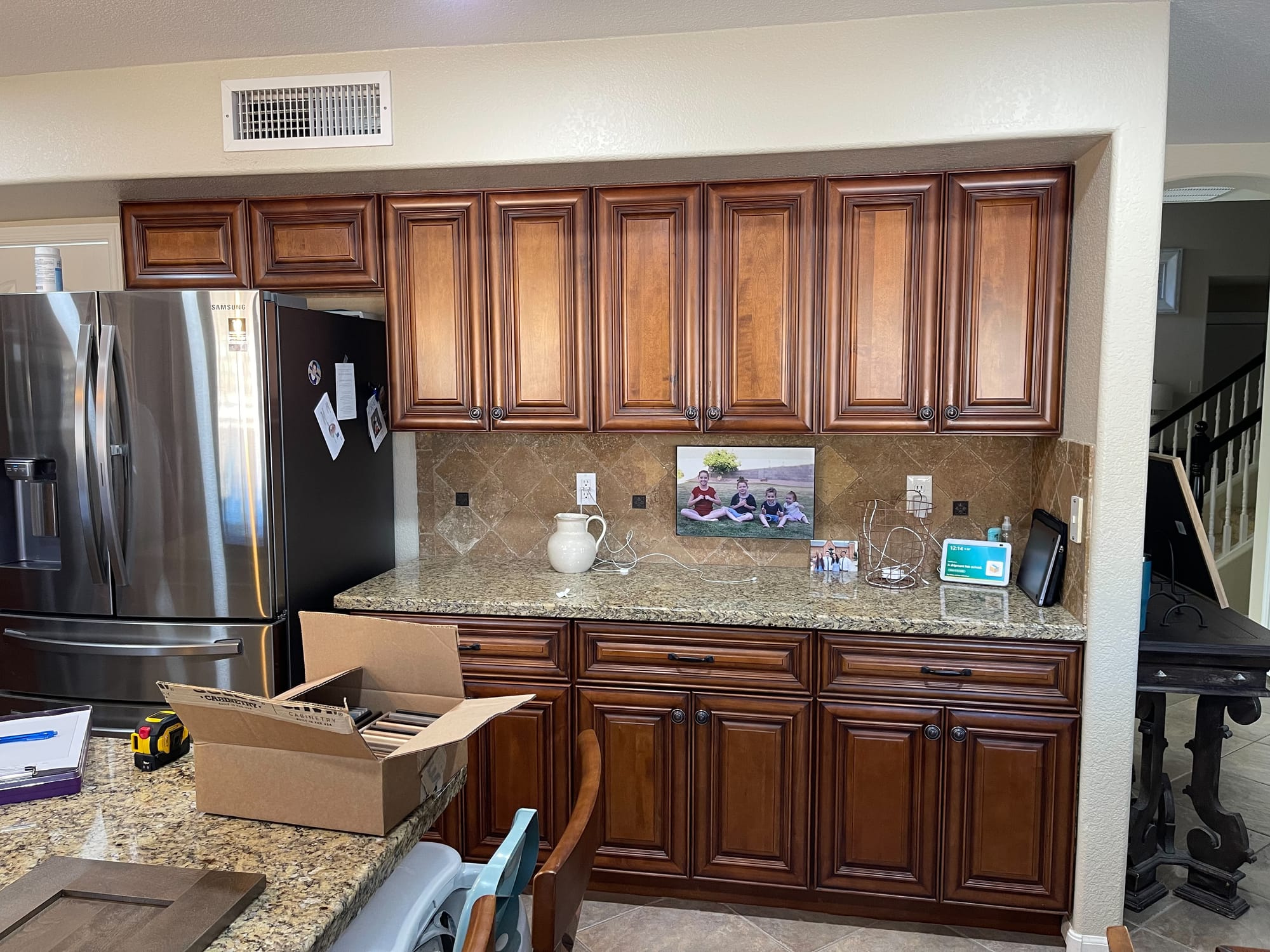 Gilbert kitchen before — busy granite countertops and dark ceramic tile
