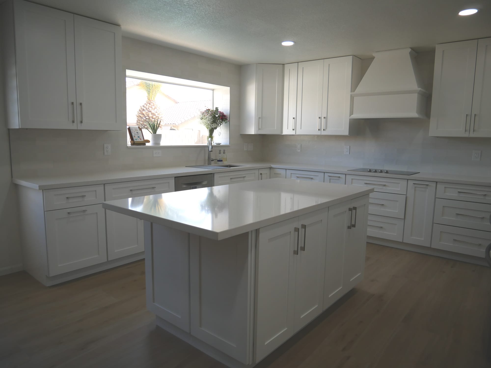 Gilbert kitchen — custom white wood range hood with Spark White subway tile