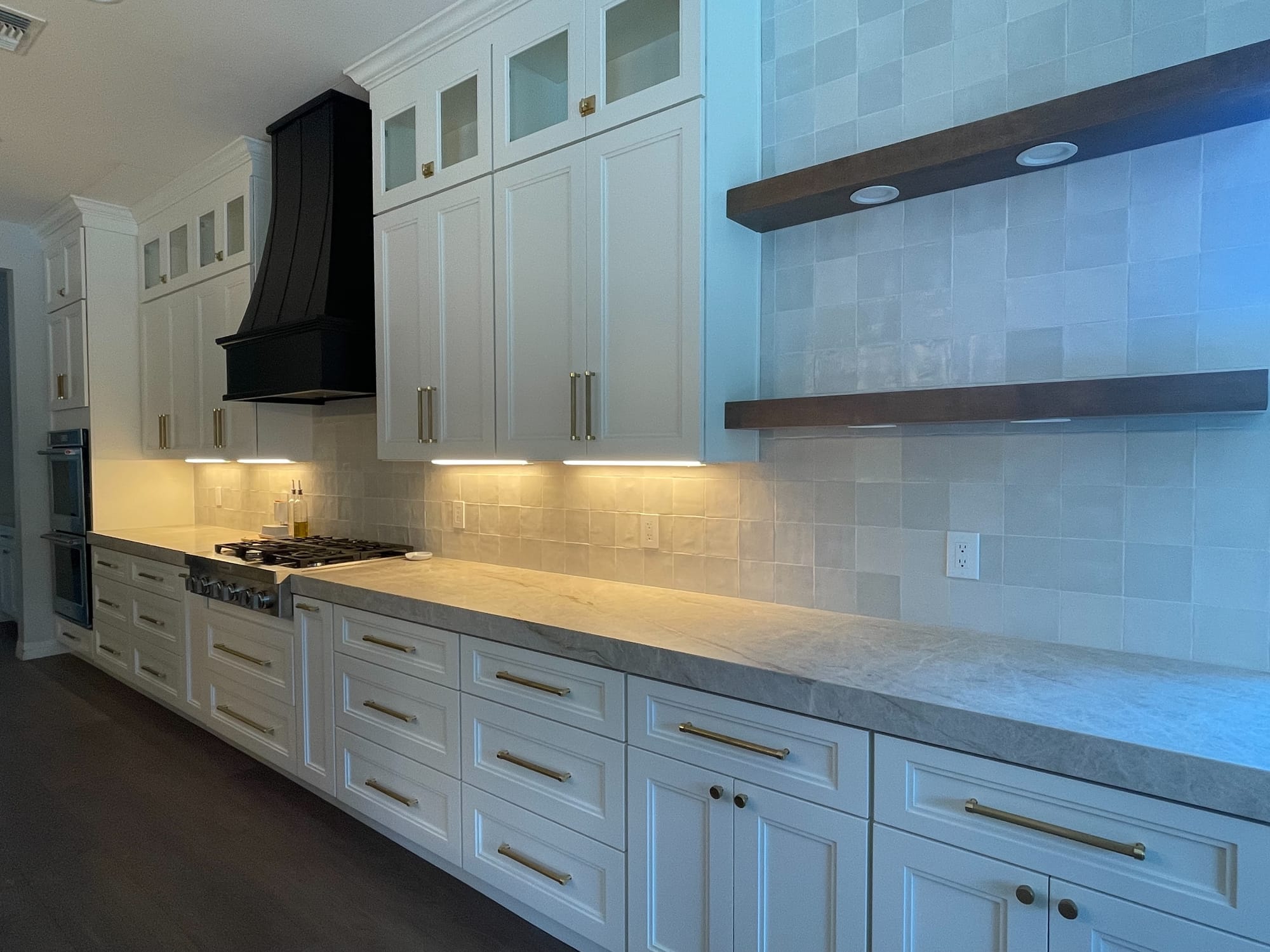 Mesa kitchen after fire restoration — Sollid dove white cabinets and Taj Mahal quartzite island