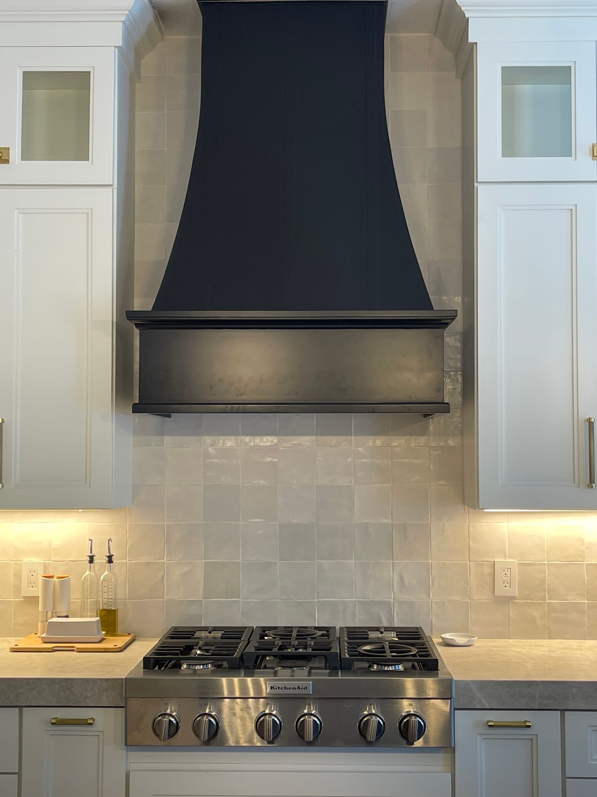 Mesa kitchen restoration — floating walnut shelves and oversized lantern pendants