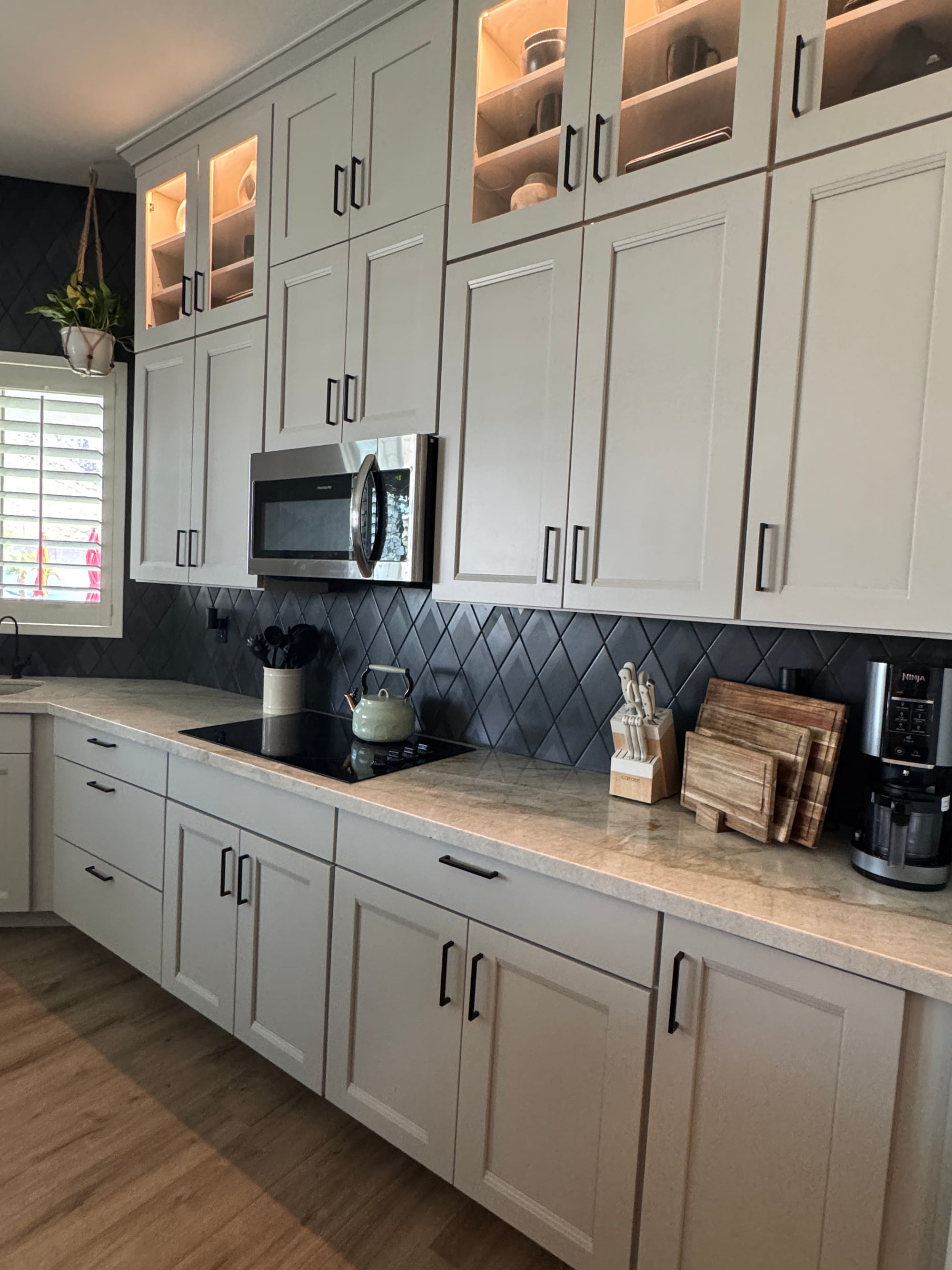 Queen Creek kitchen after — Dew Matte cabinets with dark diamond-pattern backsplash and new matte black hardware