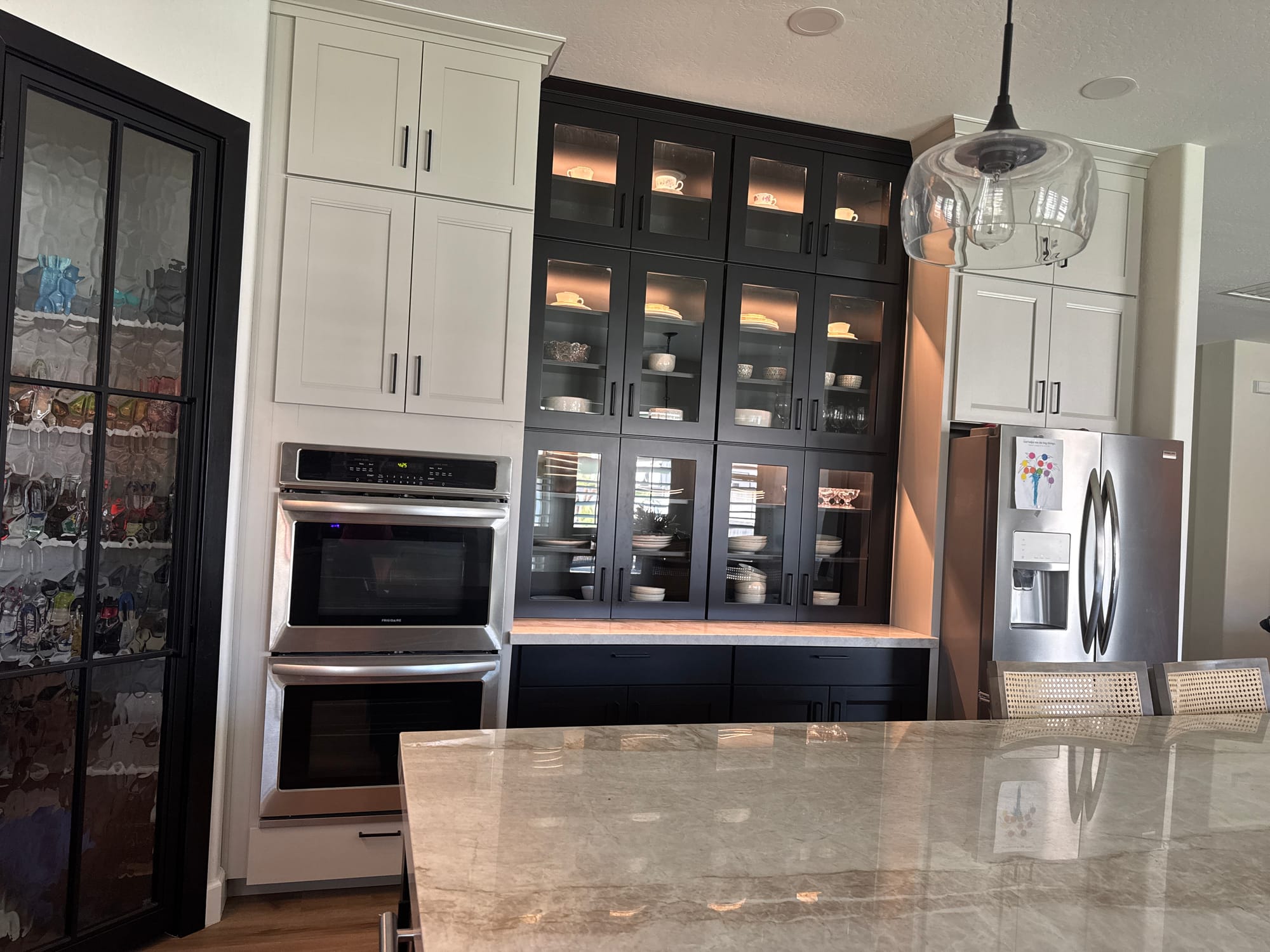 Queen Creek kitchen after — two-tone Dew Matte and black cabinets with new Sollid Napa glass-door uppers and LED display lighting