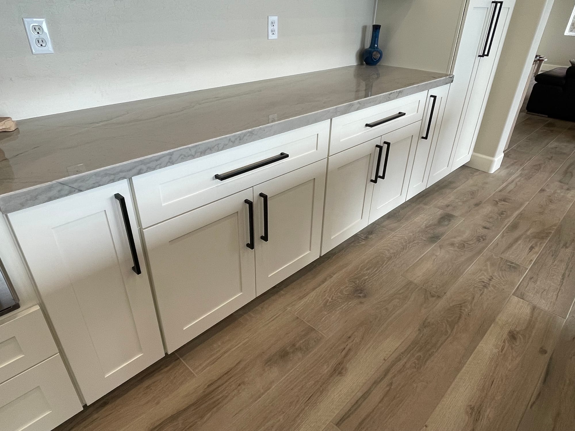 Scottsdale kitchen — GE Cafe stainless appliances and recessed lighting